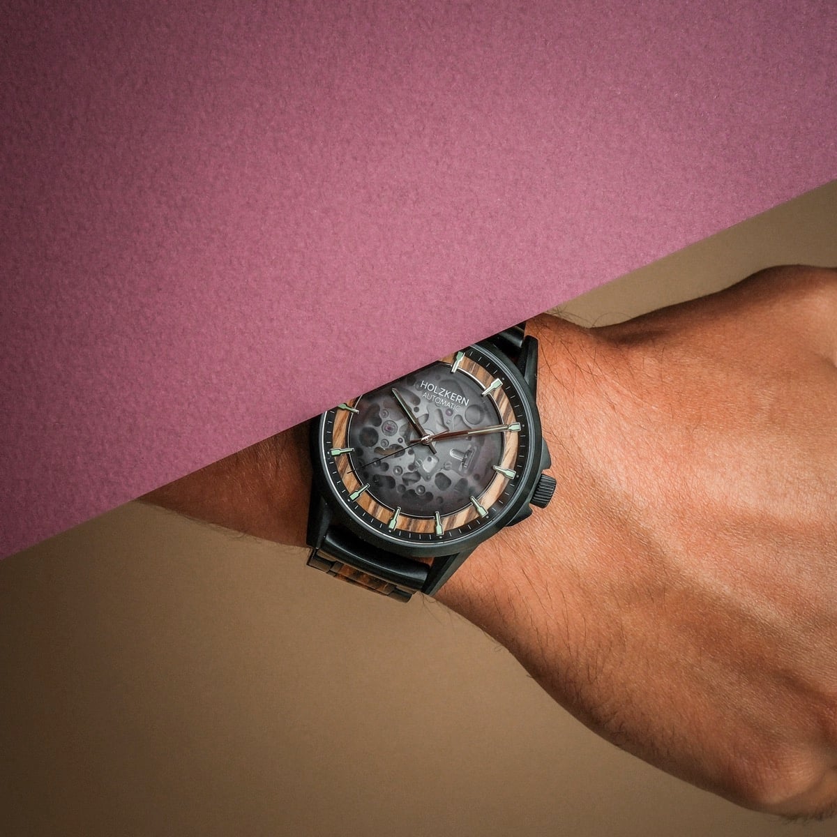 "Flowfinder" watch with zebrawood and black design, featuring a modern and elegant style.
