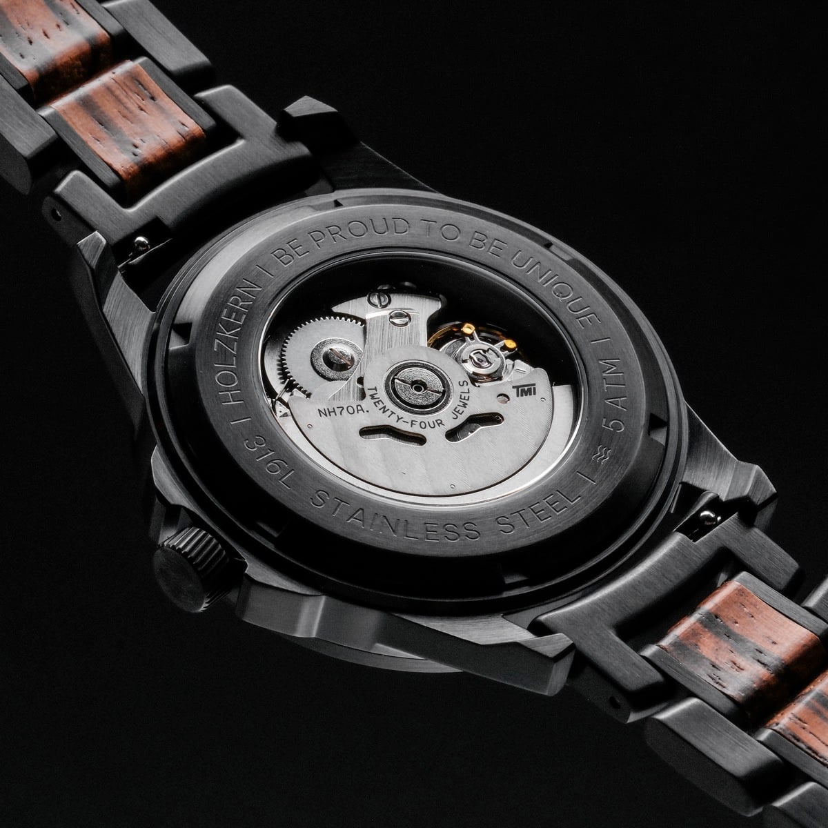 "Flowfinder" watch, featuring zebrawood and black stainless steel, showcases a sleek and sophisticated design.