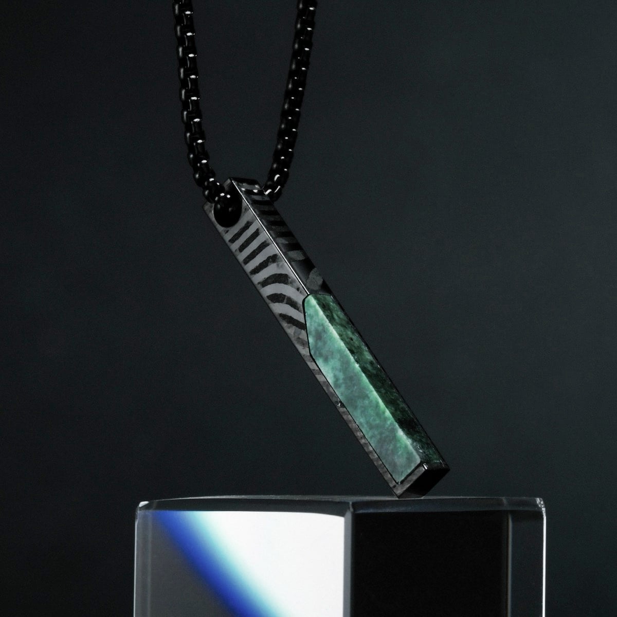 "Campania Necklace" necklace with a sleek design, featuring green marble and Damascus patterns on a dark chain.