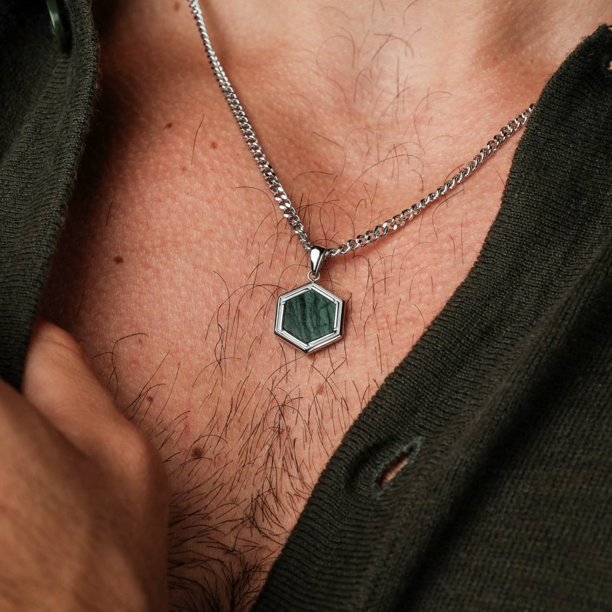 "Axis Necklace", a stylish hexagonal necklace with green marble and silver tones.