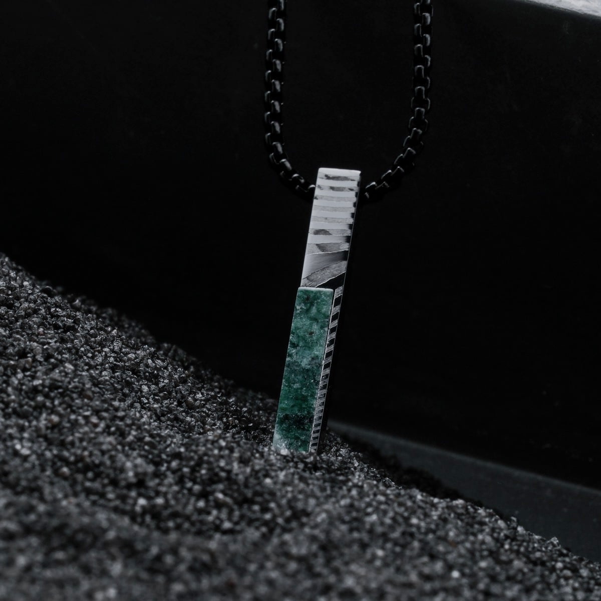 "Campania Necklace" necklace featuring a vertical design with green marble and Damascus steel, exuding a modern elegance.