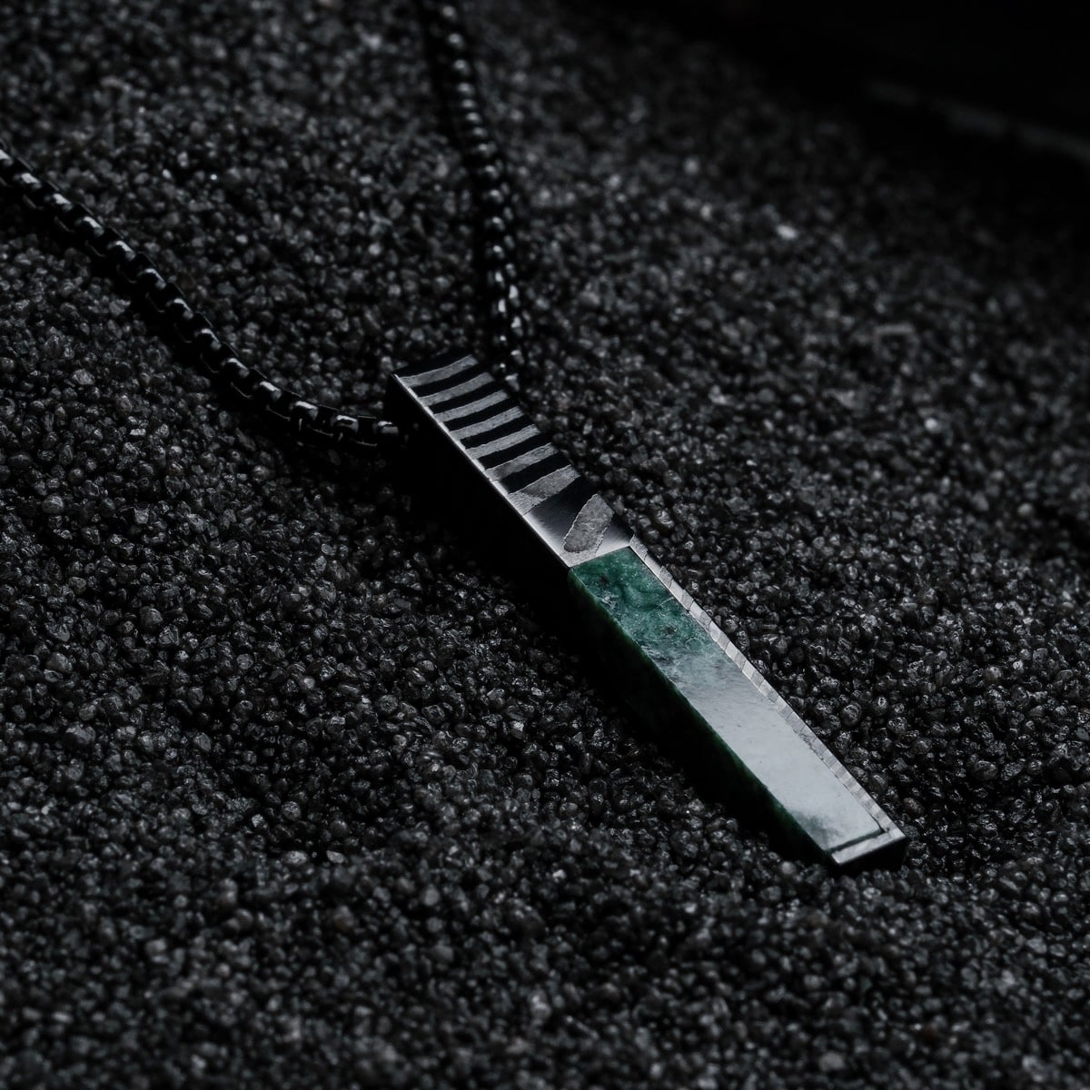 "Campania Necklace" necklace featuring green marble and Damascus steel with a sleek, modern design.