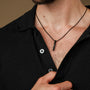 "Campania Necklace", a sleek necklace featuring green marble and Damascus elements.