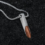 "Campania Necklace" necklace, featuring a walnut and Damascus design, with a sleek and modern visual style.