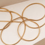 "Charms Bracelet" - Elegant gold charms bracelet featuring simple, sleek loops.
