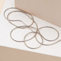 "Charms Bracelet": Elegant silver charm bracelet with a sleek and minimalist design.