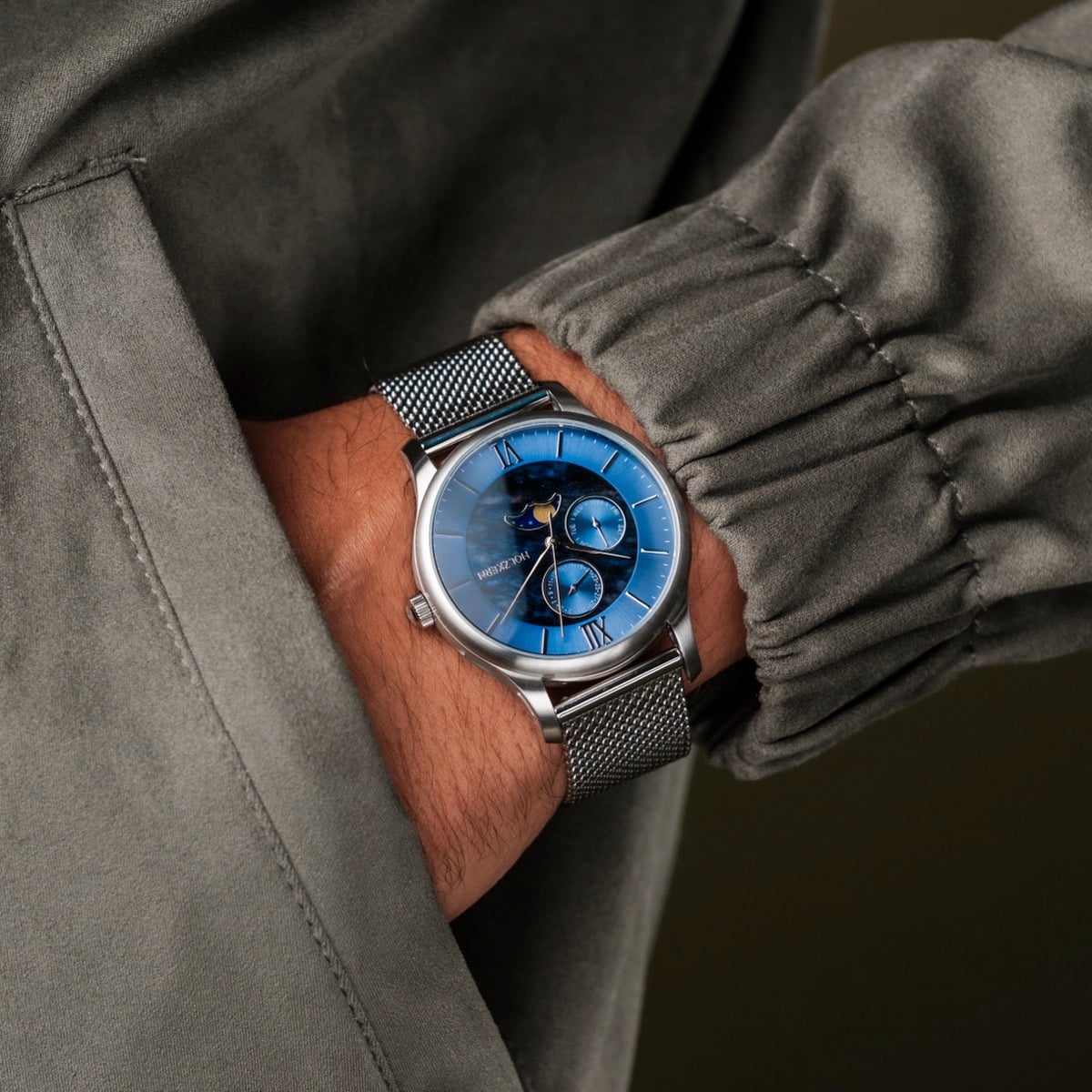 "Moonrise" wristwatch featuring a marble blue face and silver mesh band for a sophisticated look.