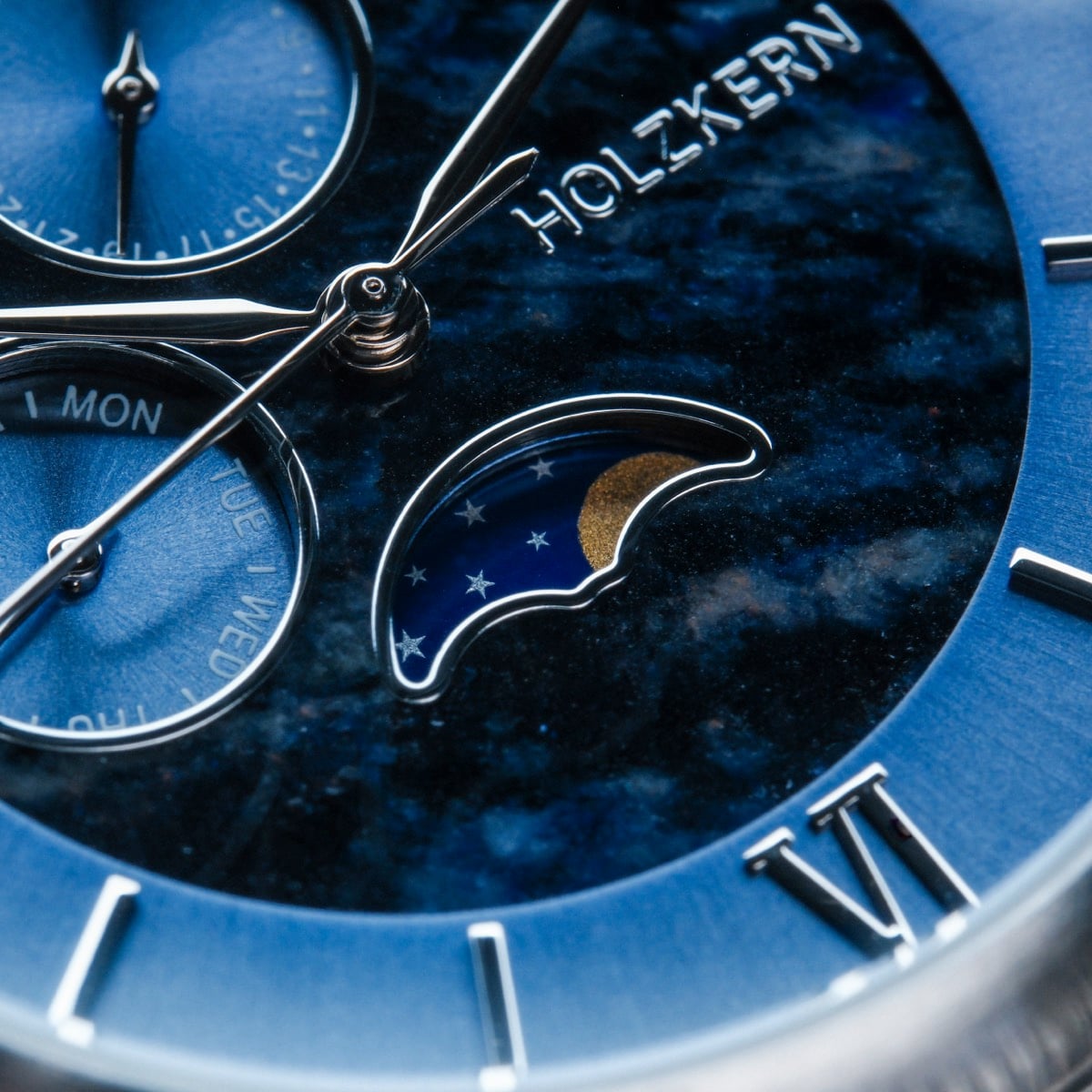 "Moonrise" watch features a marble dial with silver accents and celestial design.