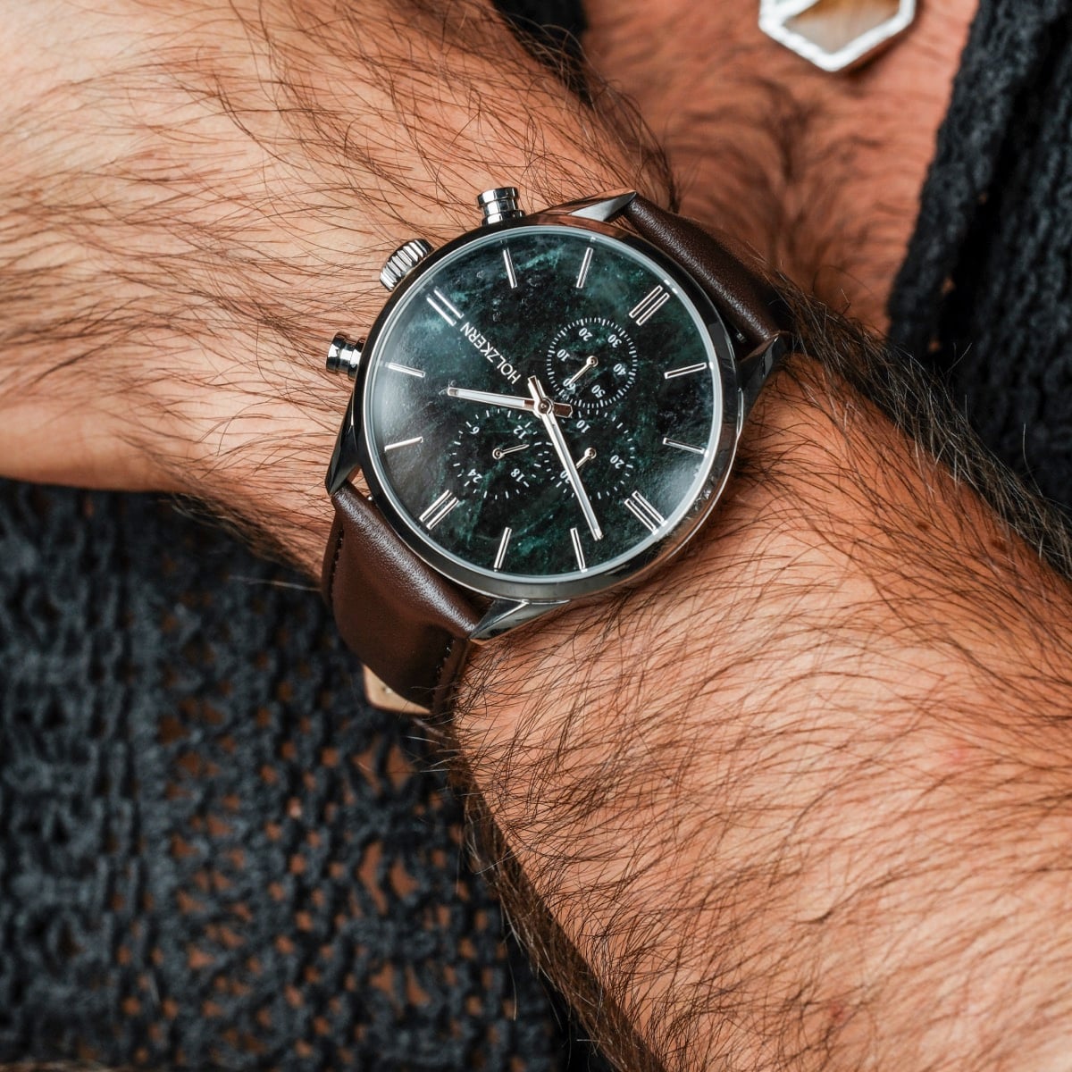 "Gifted" watch, featuring a green marble face and dark brown leather strap, exudes elegance and sophistication.