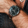 "Gifted" watch, featuring a green marble face and dark brown leather strap, exudes elegance and sophistication.