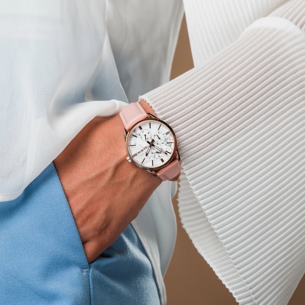 "Gifted" watch with a howlite dial and pink strap, showcasing an elegant and stylish design.