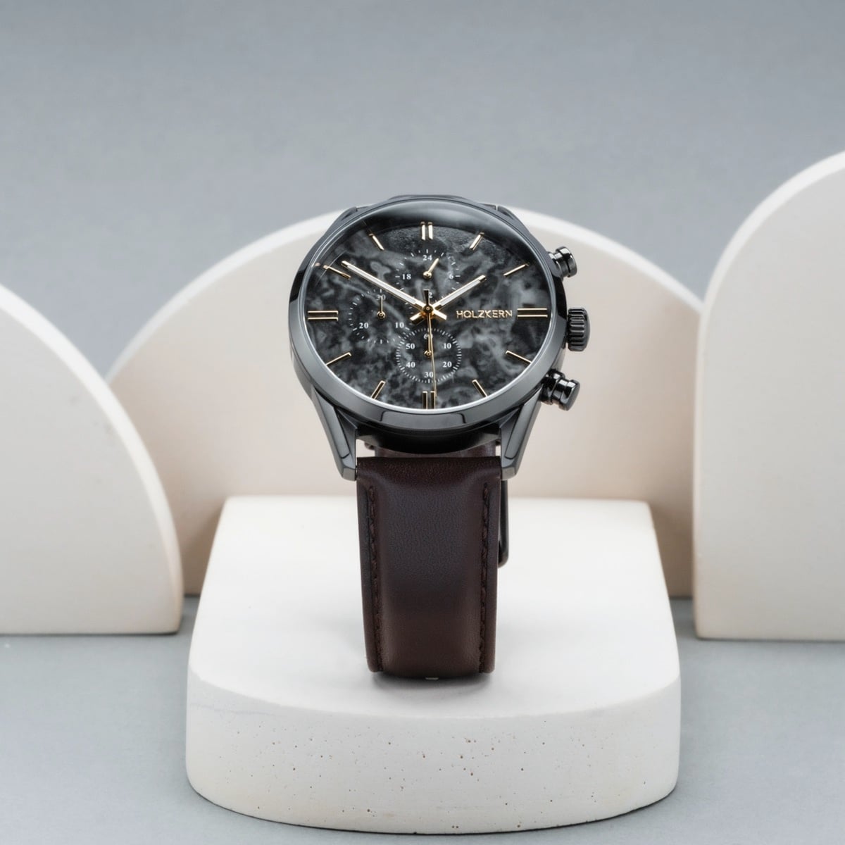 "Gifted" watch featuring a gray marble dial and dark brown leather strap, offering a sleek and elegant design.