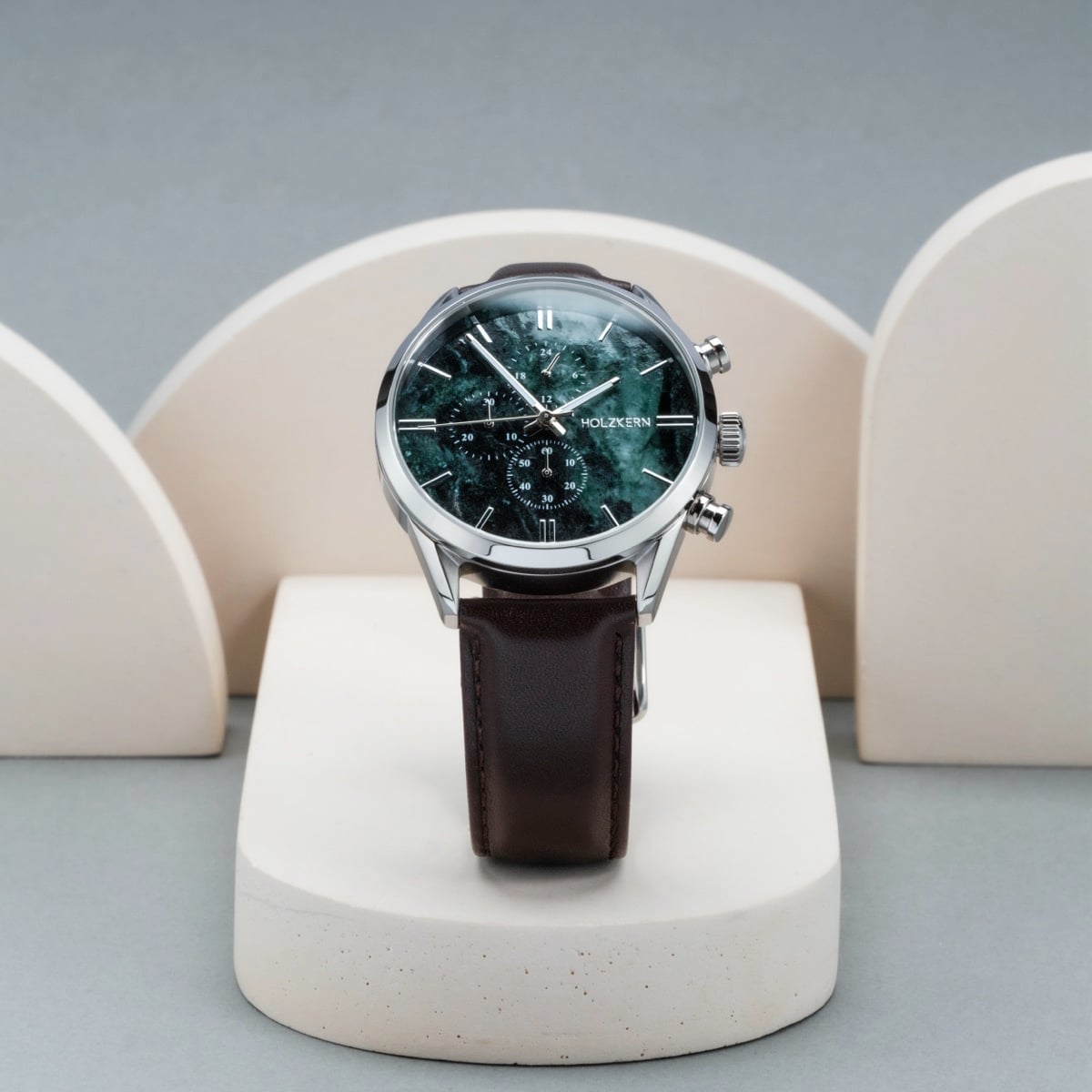 Elegant "Gifted" watch with a green marble face and dark brown leather strap, featuring a classic and sophisticated design.