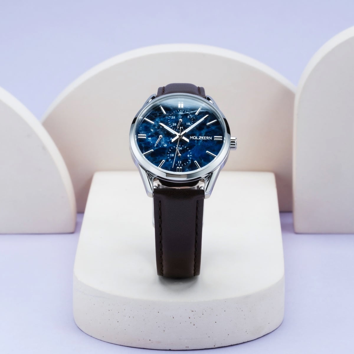 "Gifted" watch with sodalite face and dark brown leather strap, elegant design.