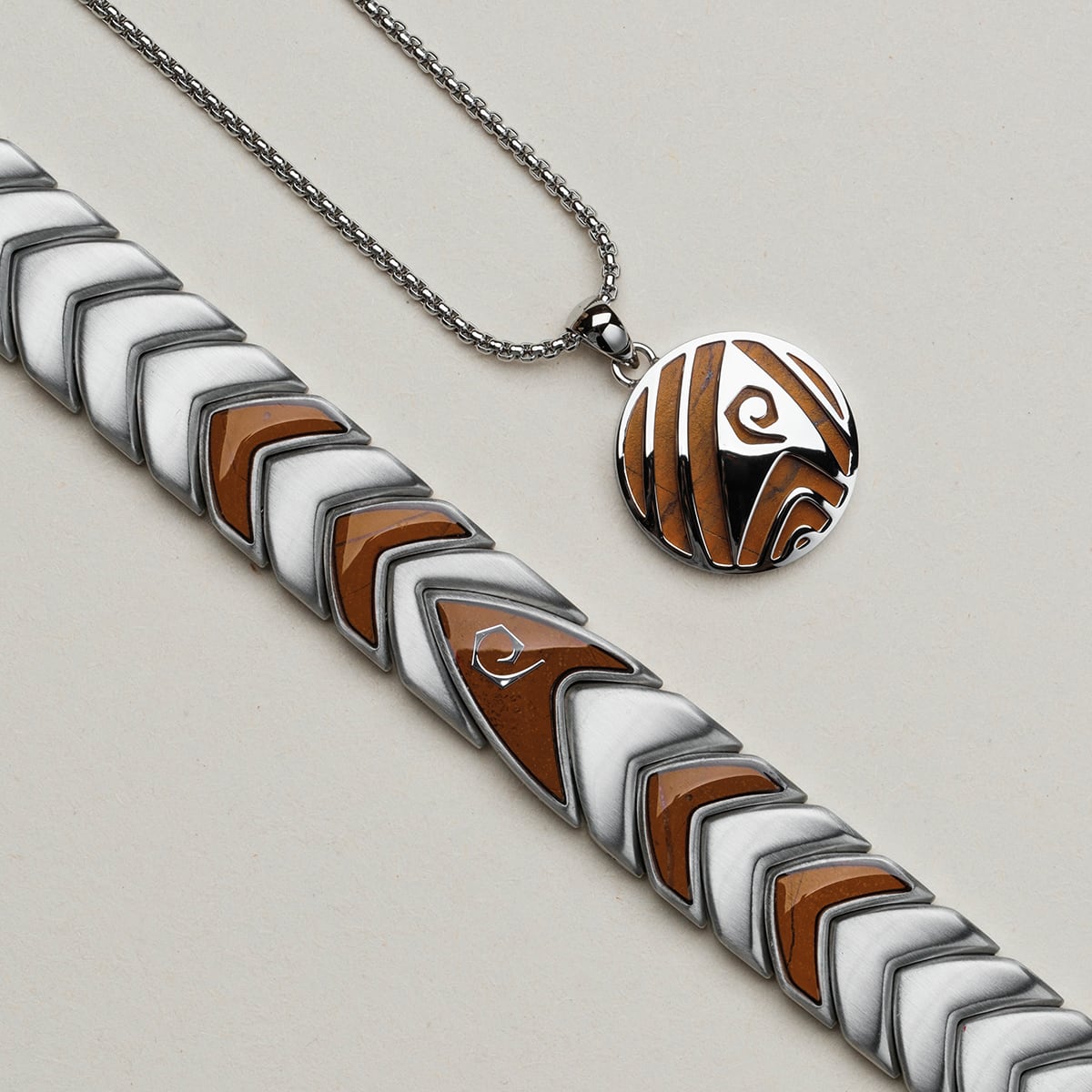 "Operations" jewelry set featuring a jasper and silver design with geometric patterns.