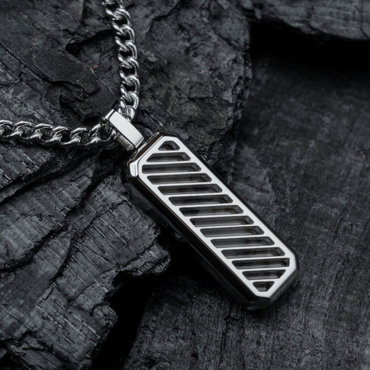 "Interplay Necklace", a sleek necklace featuring gray marble and silver, with a modern design.