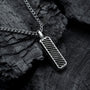 "Interplay Necklace" necklace featuring a sleek gray marble and silver design on a textured background.