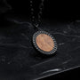 "Interplay Necklace" necklace featuring a koa wood and gray design, set against an elegant chain.