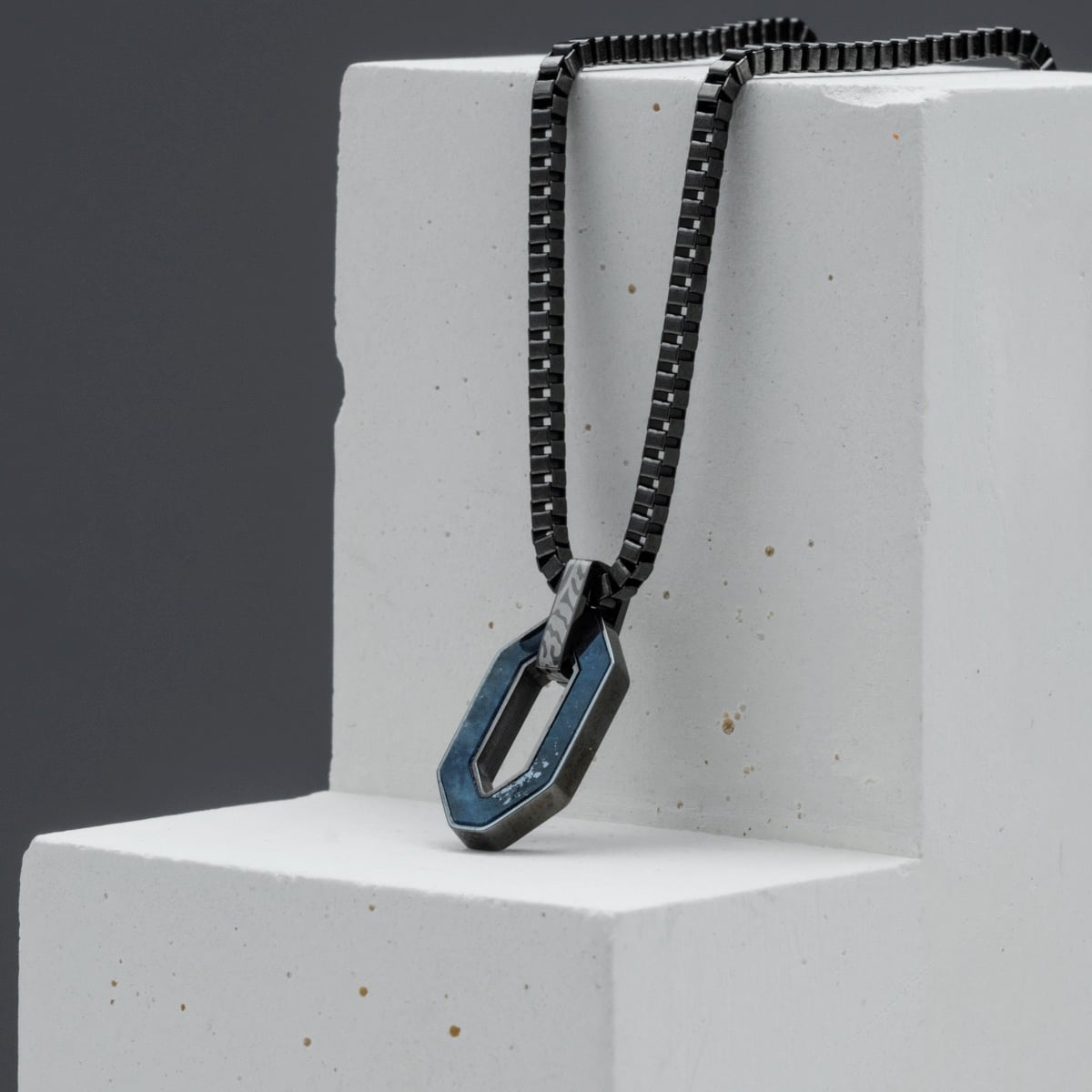 "Interplay Necklace" necklace featuring a geometric pendant, crafted from sodalite and Damascus, with a modern, edgy design.