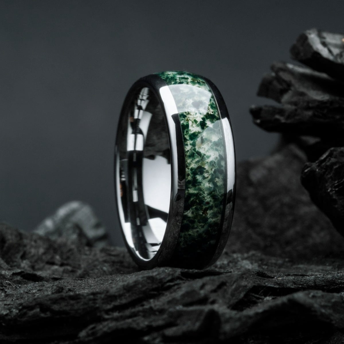 "Sumo Ring" features a striking agate inlay on a sleek tungsten band, exhibiting a bold and modern aesthetic.