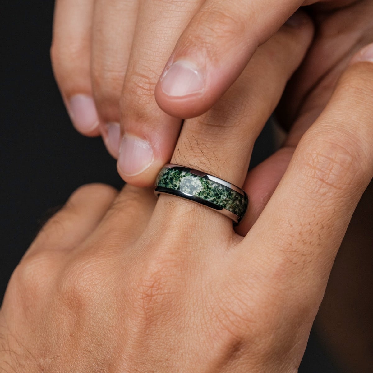 "Sumo Ring" ring featuring a sleek agate and tungsten design on a hand.