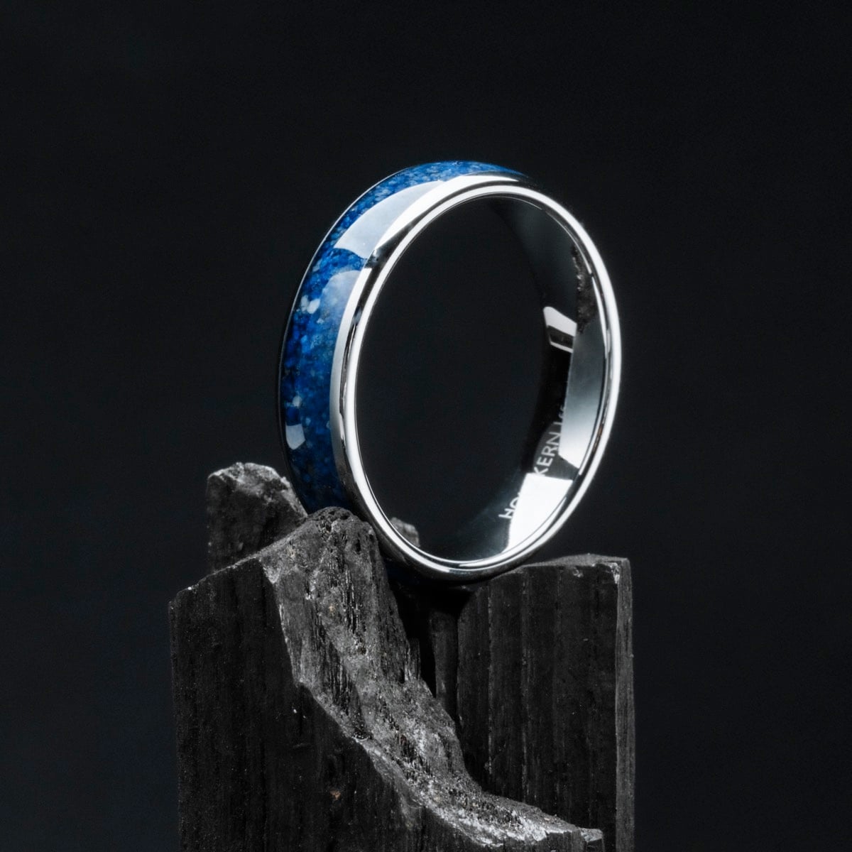 "Sumo Ring", a sleek and polished ring with a lapis lazuli inlay set in tungsten, exuding modern elegance.