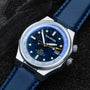 "GMT Cloudhopper" watch featuring a marble and blue design with a sleek, modern style.