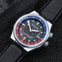 "GMT Cloudhopper" watch showcasing a marble and black design with a stylish bezel and leather strap.