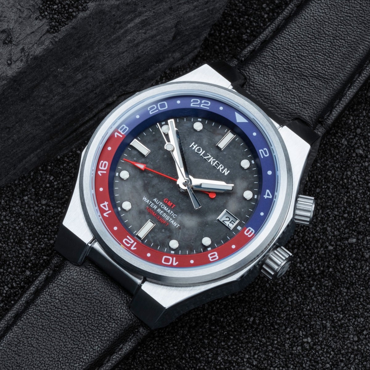 "GMT Cloudhopper" watch showcasing a marble and black design with a stylish bezel and leather strap.