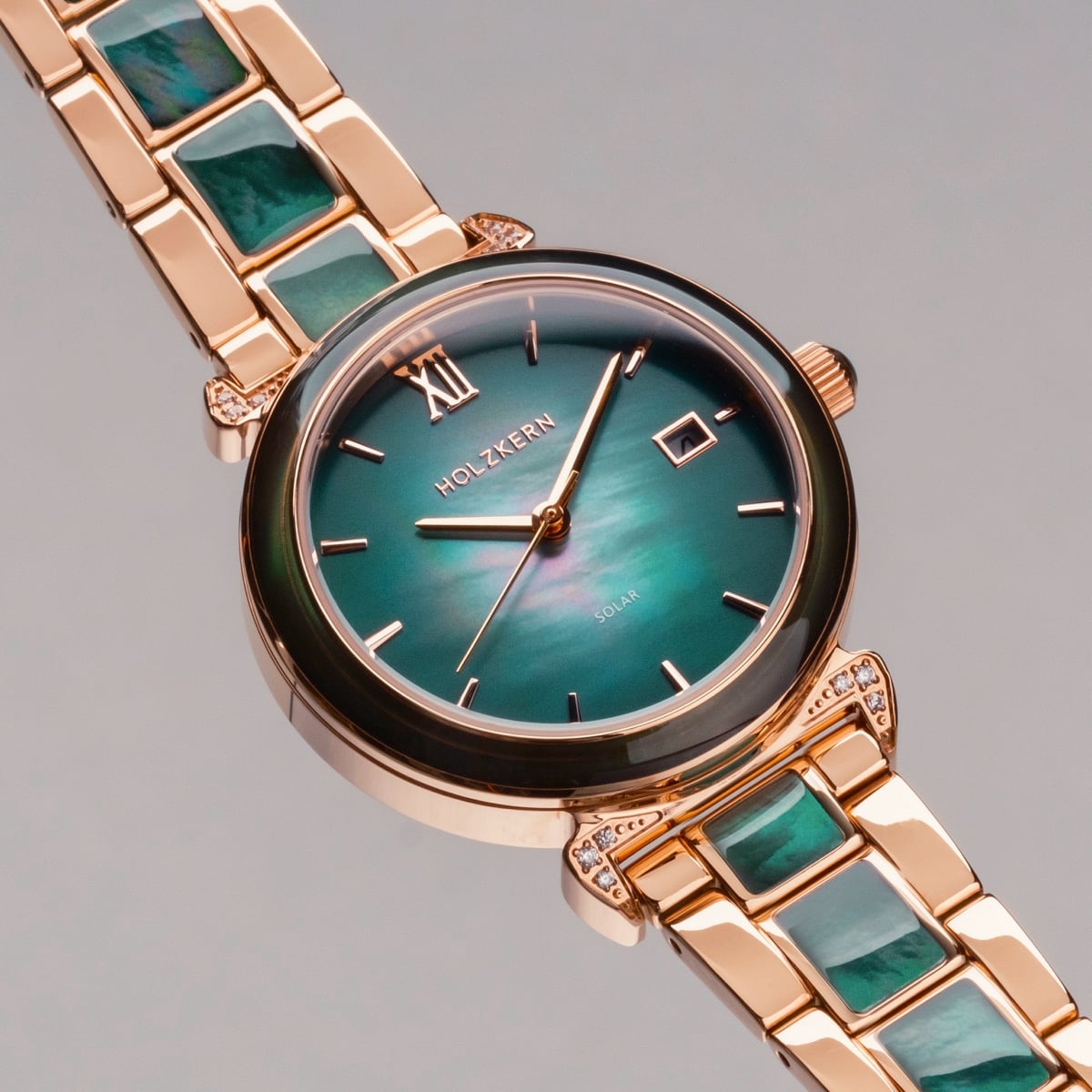 "Sunglister" watch with green mother-of-pearl dial and rose gold accents.