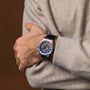 "GMT Cloudhopper" watch featuring a sleek marble and black design on a wrist.