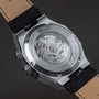 "GMT Cloudhopper" watch featuring a marble and black design with visible mechanical movement.