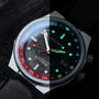 "GMT Cloudhopper" watch, featuring a marble dial and black accents with GMT functionality.