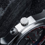 "GMT Cloudhopper" watch featuring a sleek marble and black design with intricate detailing.