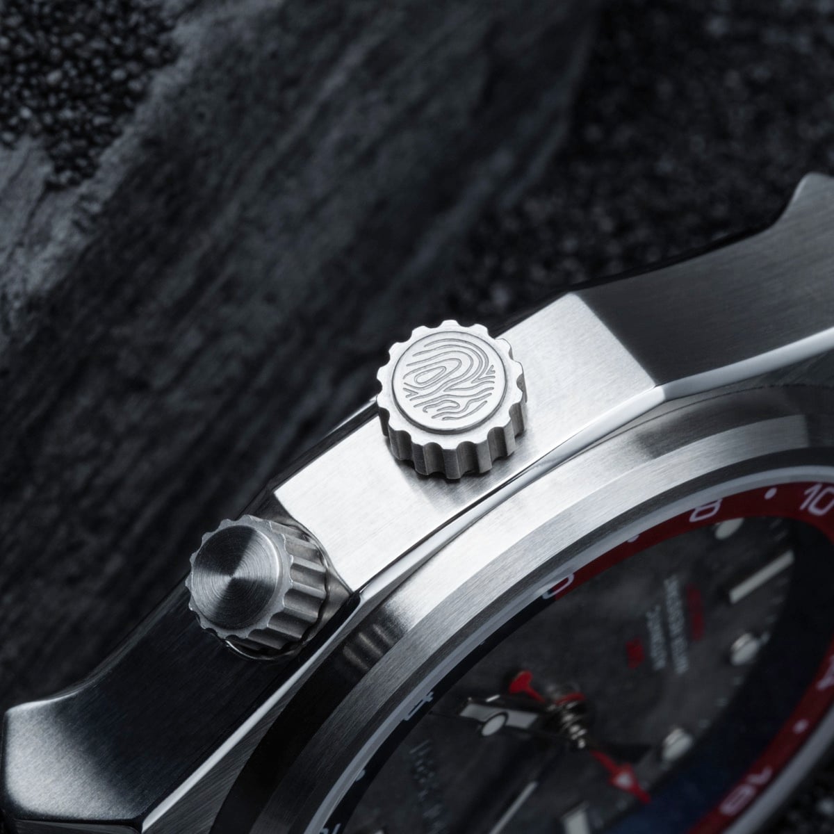 "GMT Cloudhopper" watch featuring a sleek marble and black design with intricate detailing.