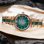 "Sunglister" watch featuring a green mother-of-pearl face and rose gold accents.