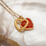 "Amorance Necklace" necklace featuring chalcedony and gold heart pendant with elegant chain.