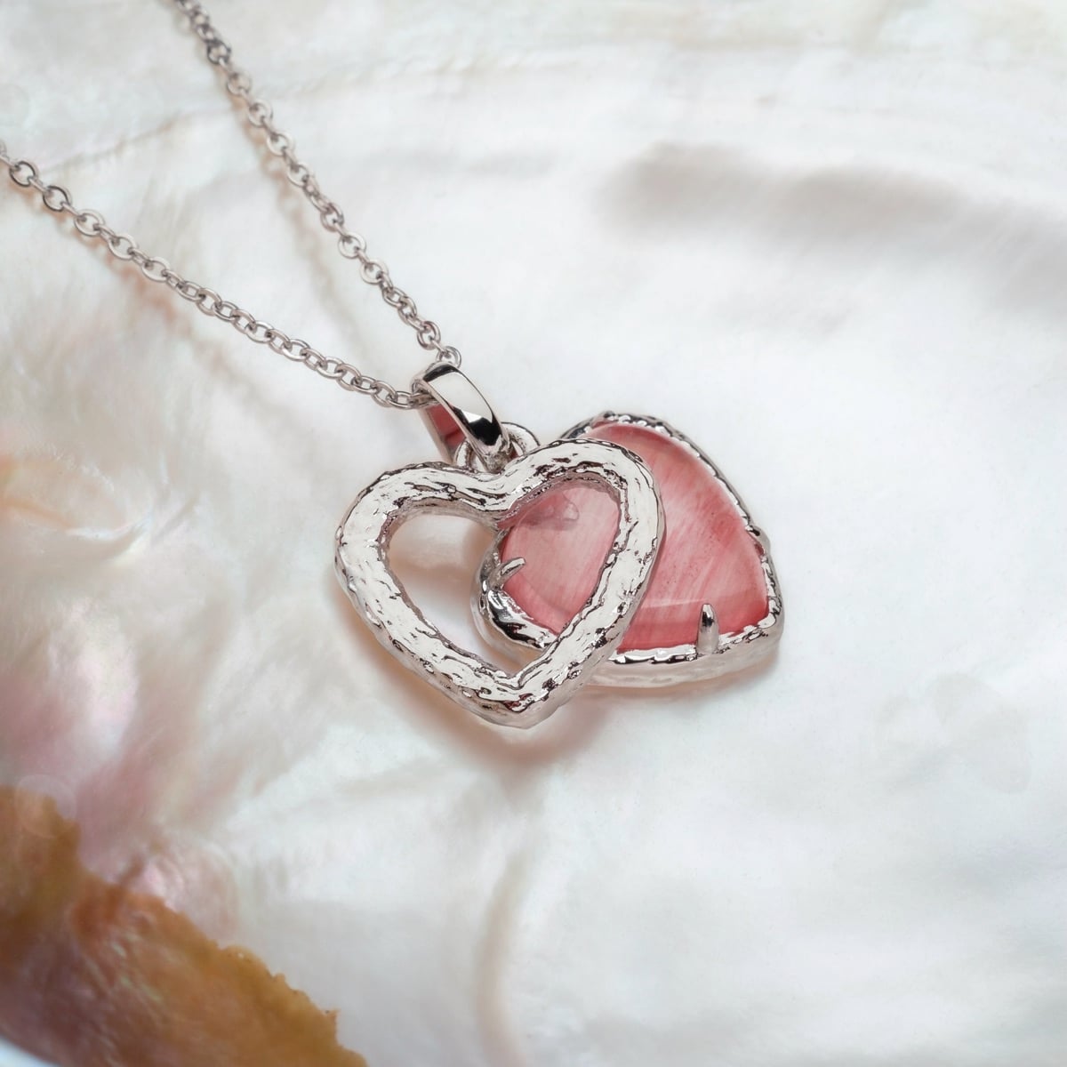 "Amorance Necklace" necklace featuring a heart design in quartz and silver, elegantly styled on a delicate chain.