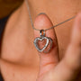 "Amorance Necklace", a quartz and silver necklace with a heart-shaped pendant, displayed elegantly.