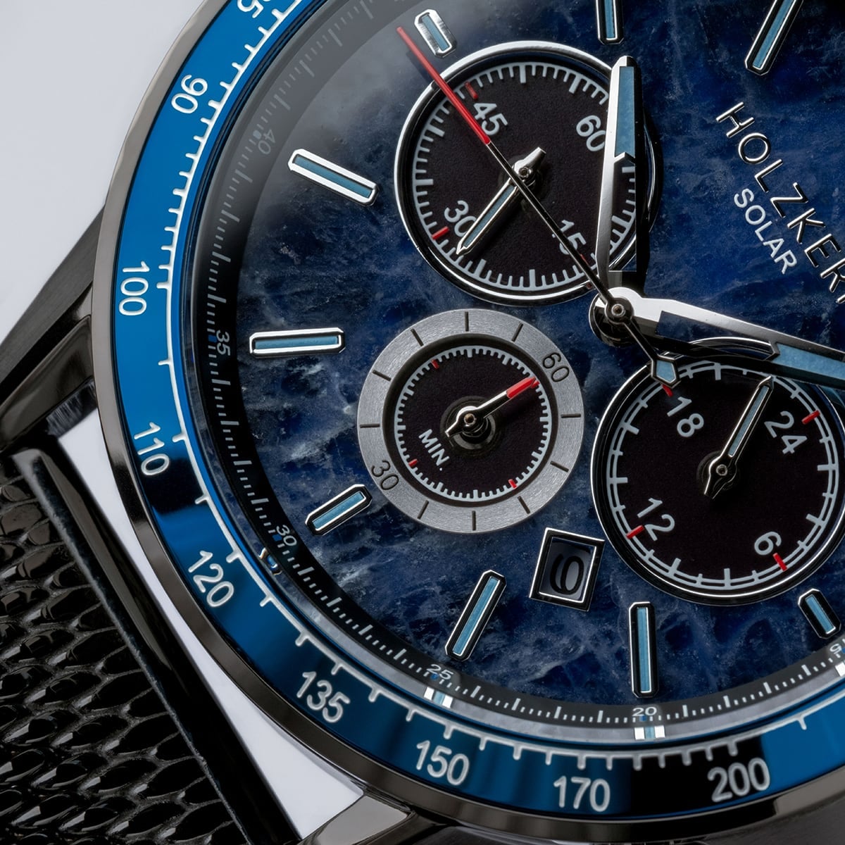 "Comfort Crusher", a sophisticated watch with a sodalite and dark gray design featuring intricate dials and a leather strap.