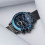 "Comfort Crusher" watch featuring a sodalite and dark gray dial with a sleek, modern design.