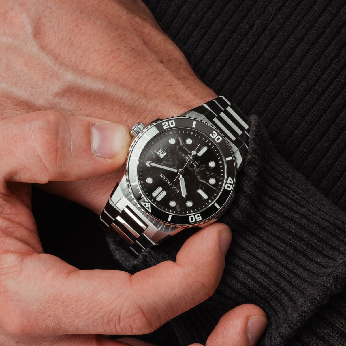 "Deepdiver" watch in marble and silver with a sleek, sporty design.