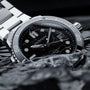 "Deepdiver" diving watch combining marble and silver with a sleek, modern aesthetic.