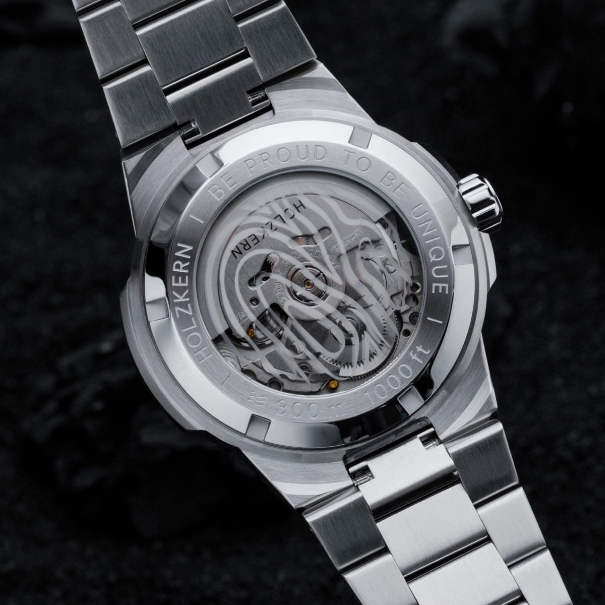 "Deepdiver" watch showcasing a sleek marble and silver design with intricate mechanical details.