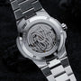 "Deepdiver" watch showcasing a sleek marble and silver design with intricate mechanical details.