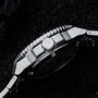 "Deepdiver" watch, featuring a sleek marble and silver design with intricate detailing.