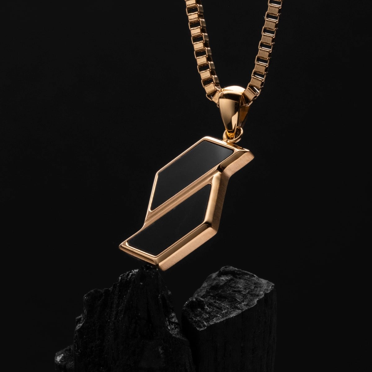 "Baritone Necklaces" necklace featuring marble and gold accents with a sleek, modern design.