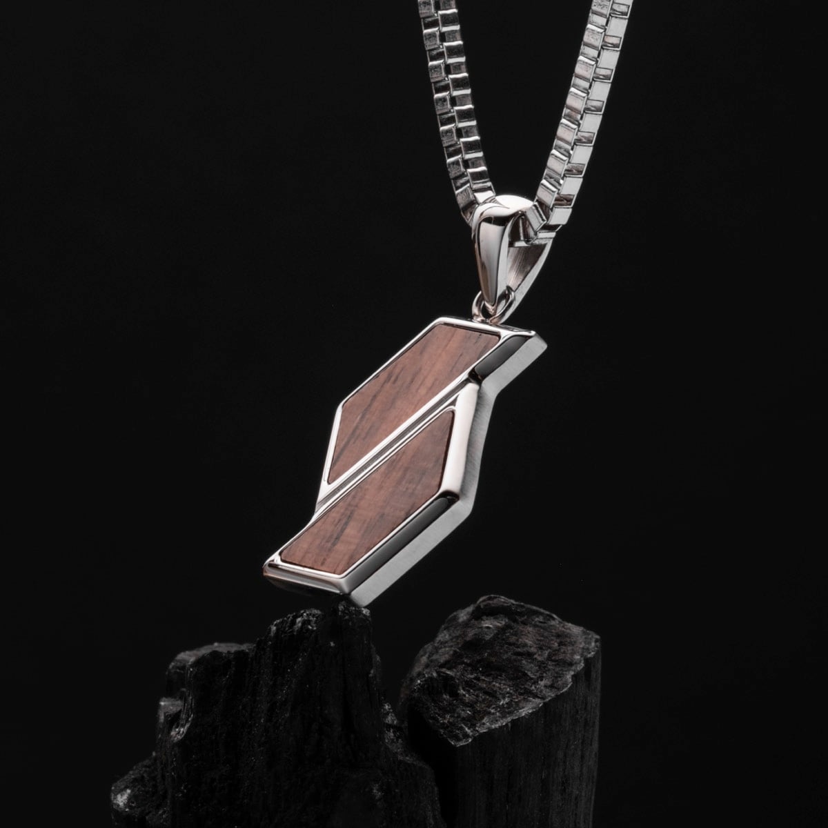 "Baritone Necklaces": a sleek geometric necklace in walnut and silver.
