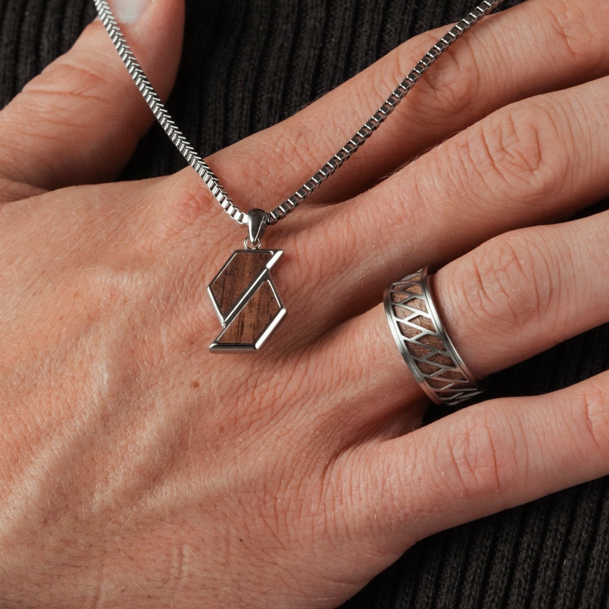"Baritone Necklaces", walnut and silver necklace, features a geometric pendant on a sleek chain.