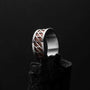 "Baritone Rings" - Elegant ring featuring a walnut inlay and silver accents, showcasing a modern geometric design.